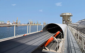 Port storage yard transfer conveying system